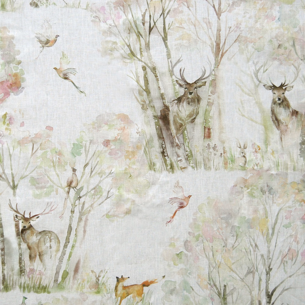 Pale woodland print on cream linen-blend fabric with deer, birds and trees