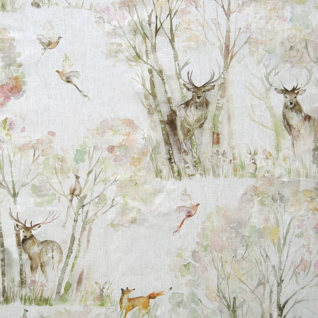 Pale woodland print on cream linen-blend fabric with deer, birds and trees