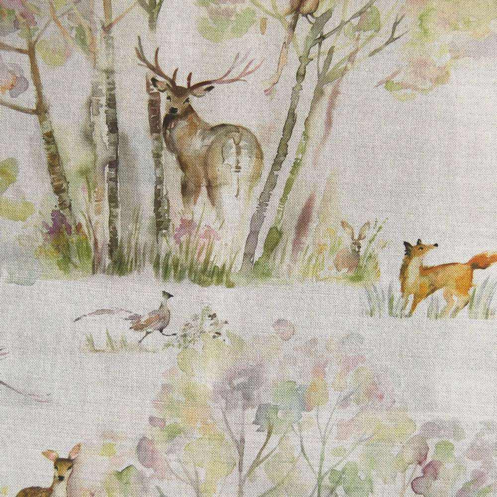 Painterly woodland fabric with deer, foxes and birds on a pale linen-textured ground