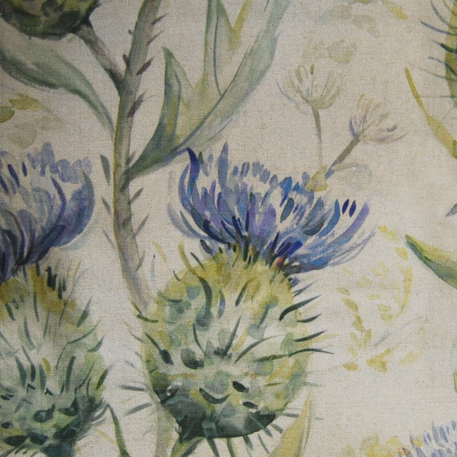 Painterly blue-violet thistle flowers and green leaves on pale linen-look fabric