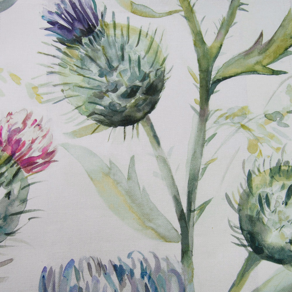 Watercolour thistle fabric with green, lilac and pink blooms on a pale ground