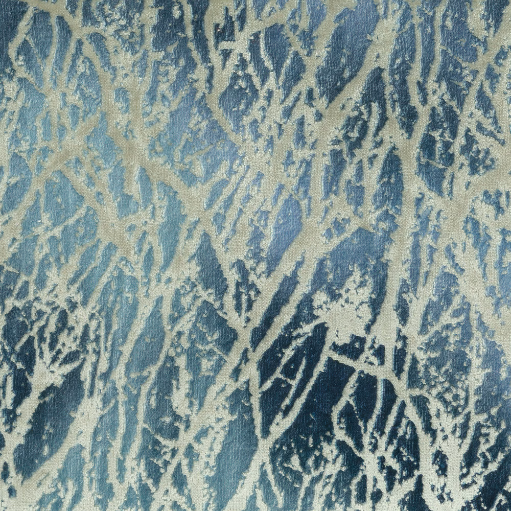 Abstract blue and ivory woven fabric with a large painterly leaf-like pattern
