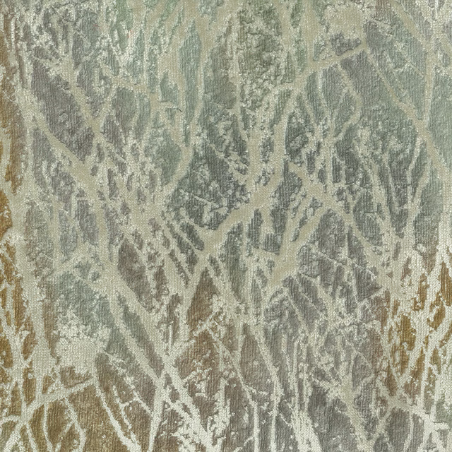 Close-up of abstract sage-gold woven fabric with pale leaf-like patterning