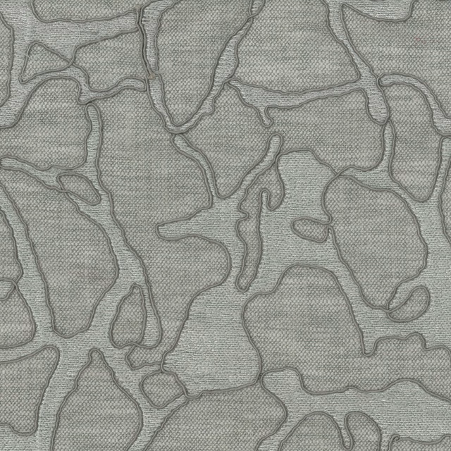 Soft misty blue abstract fabric with raised embroidered outlines on a woven ground