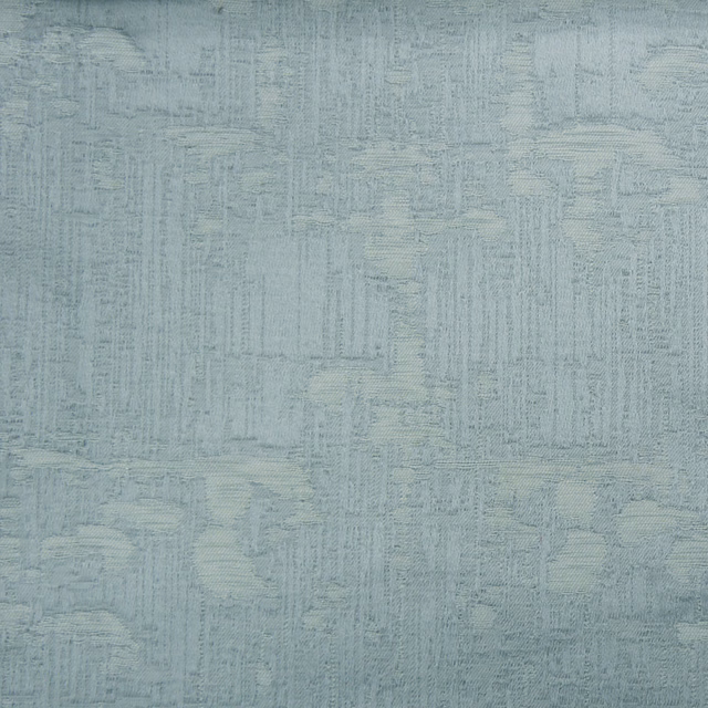 Pale cool grey textured woven fabric with a softly mottled, raised pattern