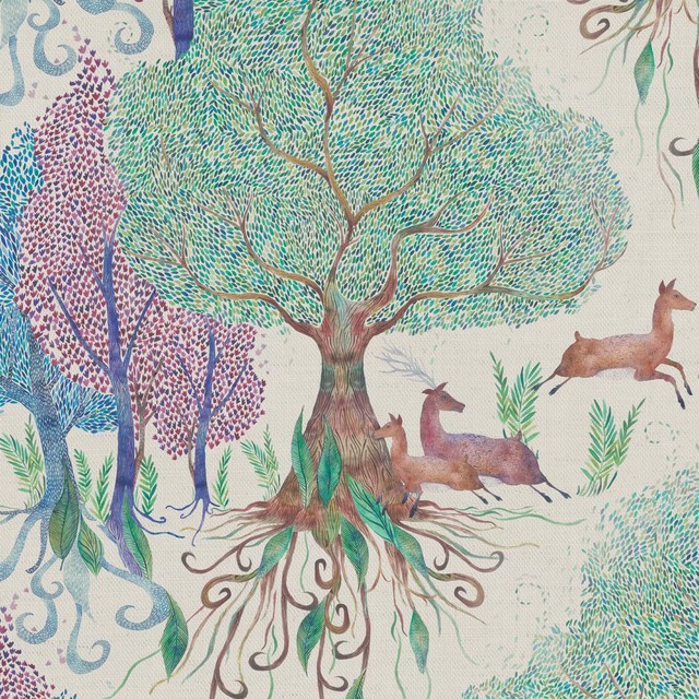 Woodland print fabric with trees, deer and leafy branches in soft multi colours