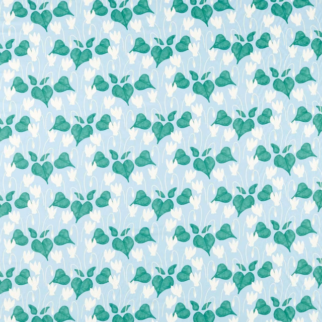 Pale sky-blue fabric with turquoise heart-shaped leaves and white stems