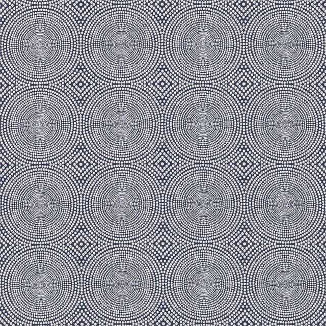 Cool indigo-blue textile with pale concentric circles and diamond outlines in a dense woven pattern