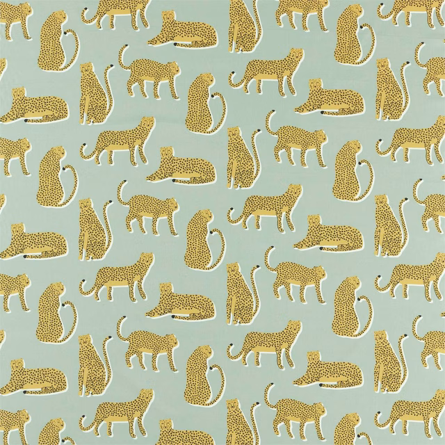Honey spotted cats and reclining animals on a pale blue-grey fabric ground