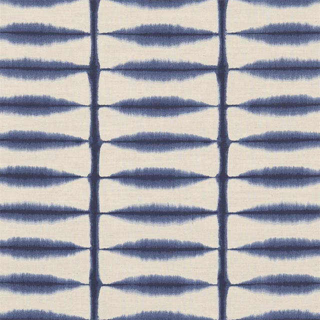 Indigo feathered motifs in a vertical grid on a linen-toned textured fabric