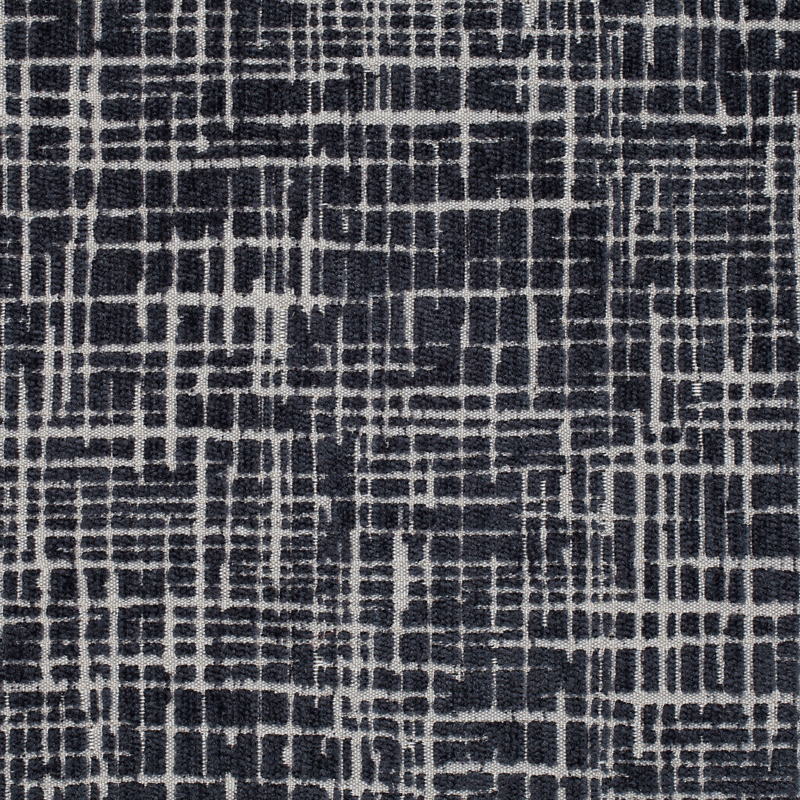Deep indigo woven fabric with an irregular pale grey broken grid motif
