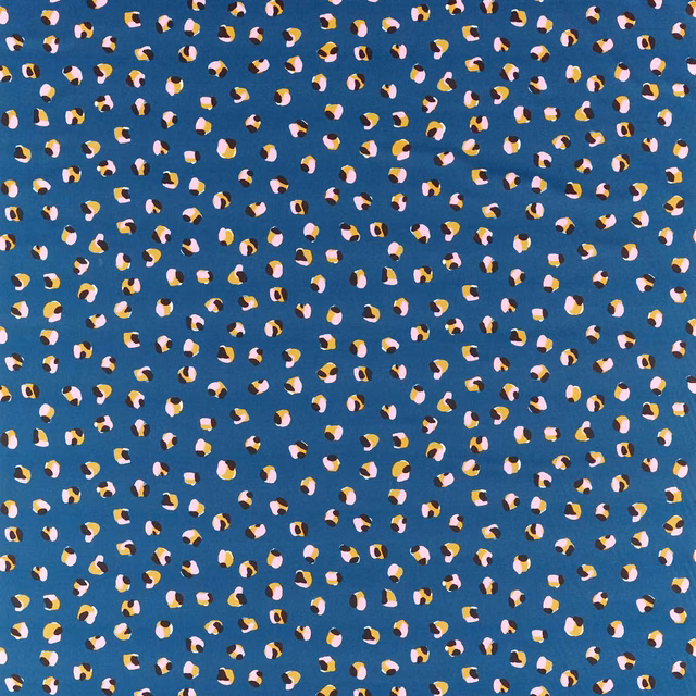 Denim-blue fabric with scattered cream, pink, mustard and black leopard dots