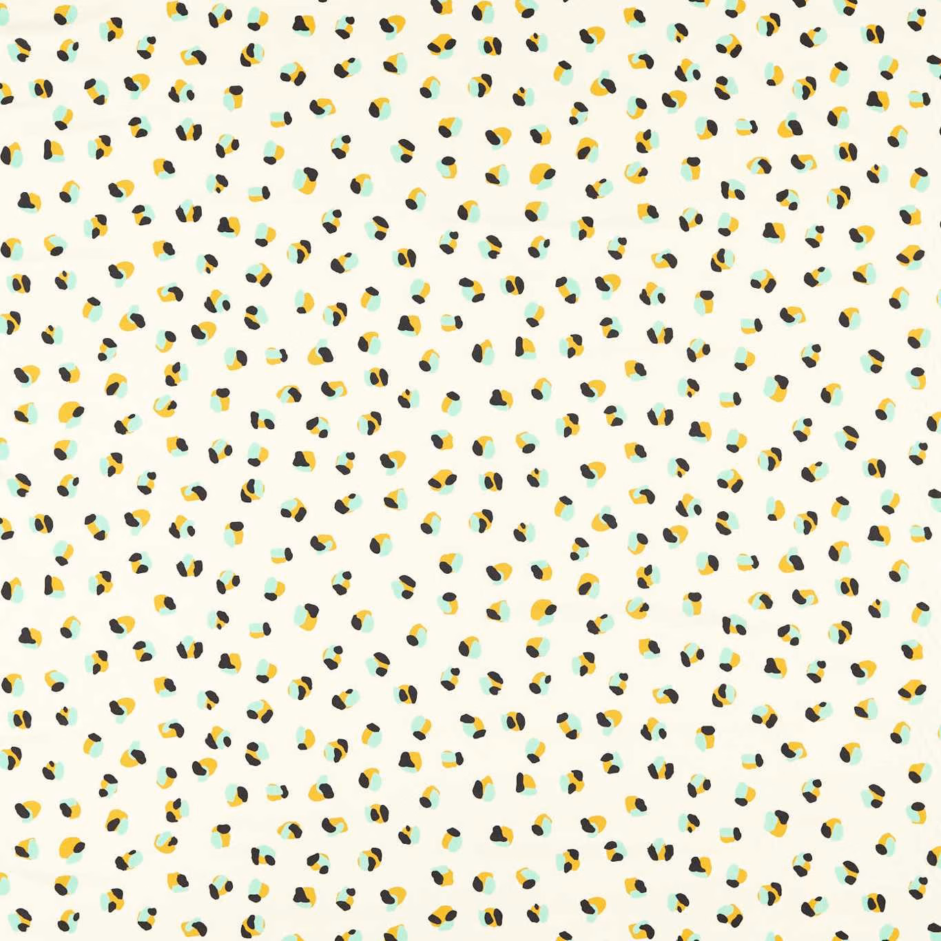 Pale ivory fabric with scattered pebble, sage and yellow leopard-like marks