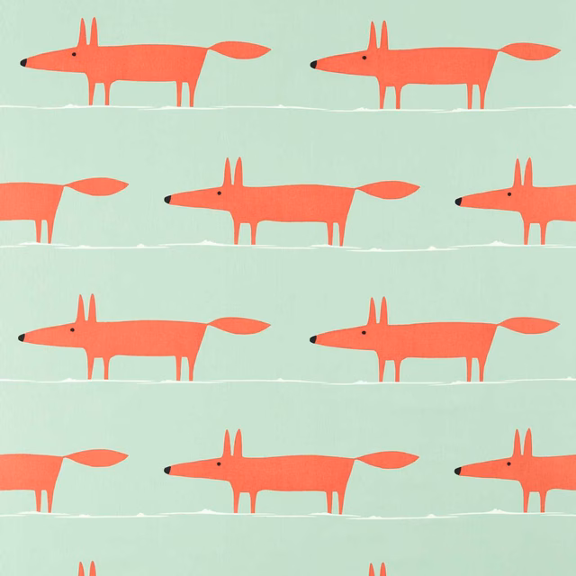 Poppy-red foxes in rows on a pale sage fabric with black noses
