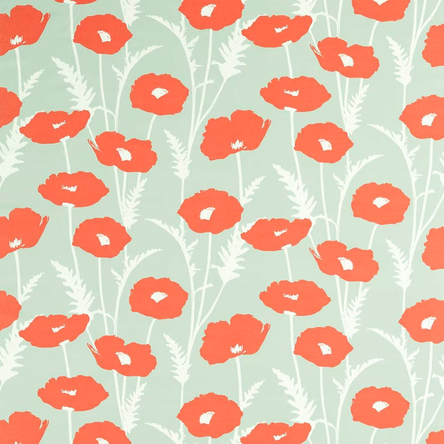 Sage-green fabric covered in hand-painted red poppies with white stems and leaves