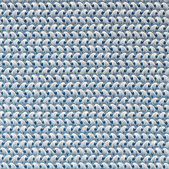Dense white wave motifs repeating across a cool denim-blue fabric ground