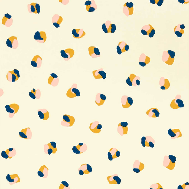 Cream wallpaper with scattered navy, blush and ochre leopard dot clusters