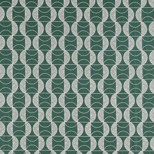 Emerald green textile with pale stippled interlocking circle motifs in a geometric repeat