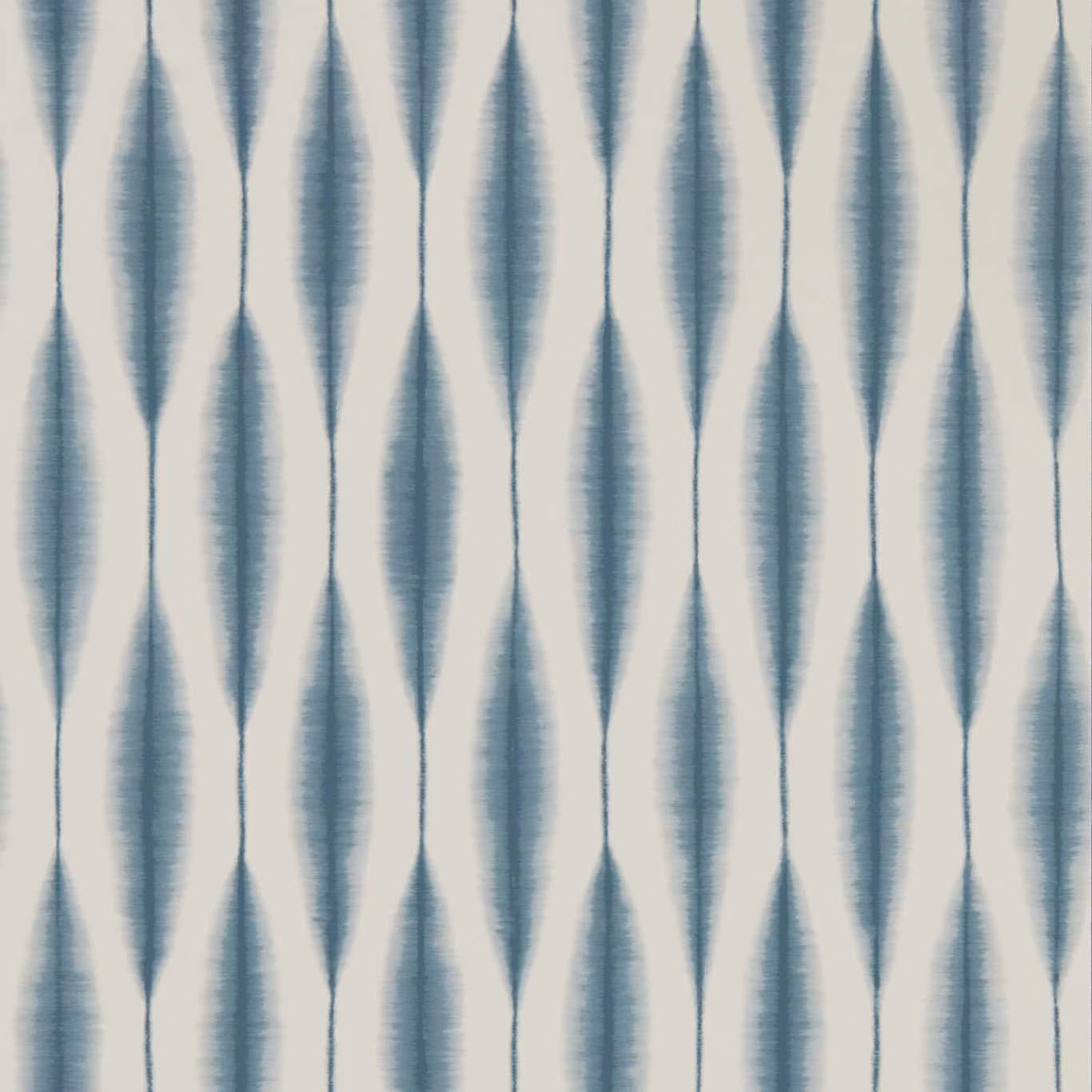 Blue-grey elongated ikat diamonds with brushed texture on an off-white ground