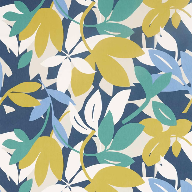 Forest-blue botanical fabric with citrus leaves, electric-blue foliage and white floral shapes
