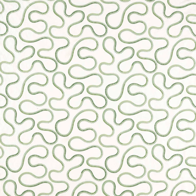 Ivory fabric with looping muted pine-green embroidery and tactile stitched edges