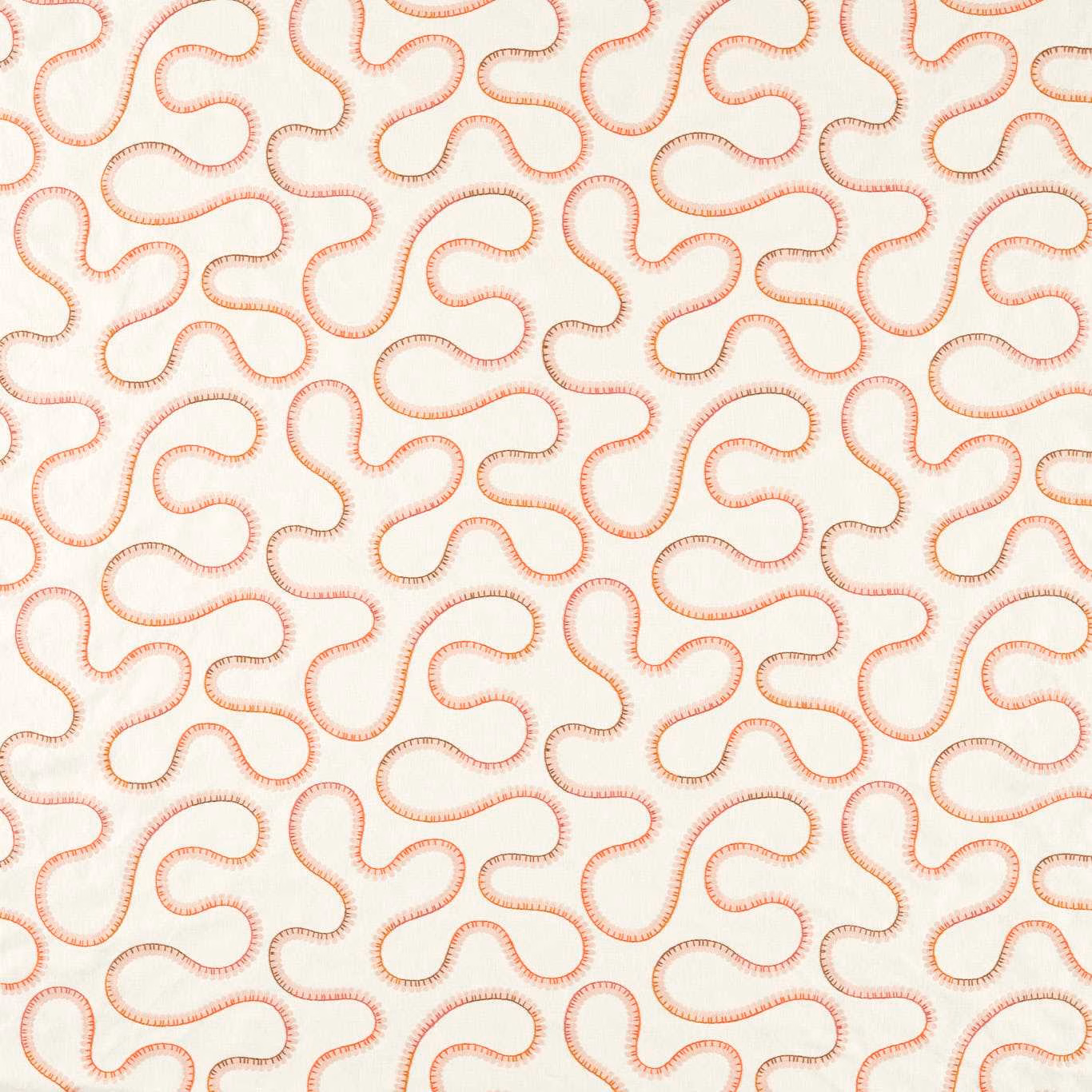 Cream embroidered fabric with warm coral looping trails in a dense repeating pattern