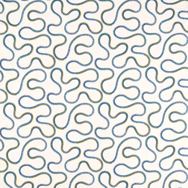 Cream fabric with repeating navy and soft gold embroidered looping squiggles