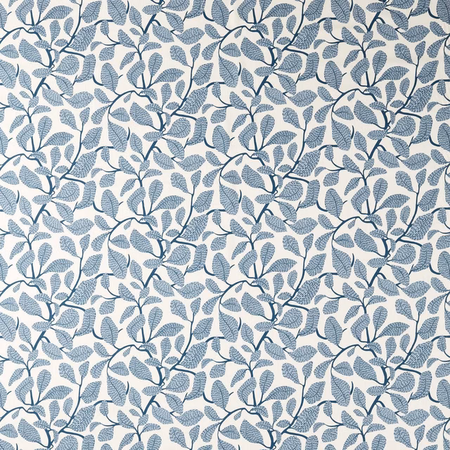 Muted indigo leafy branches across a softly warm ivory botanical fabric ground