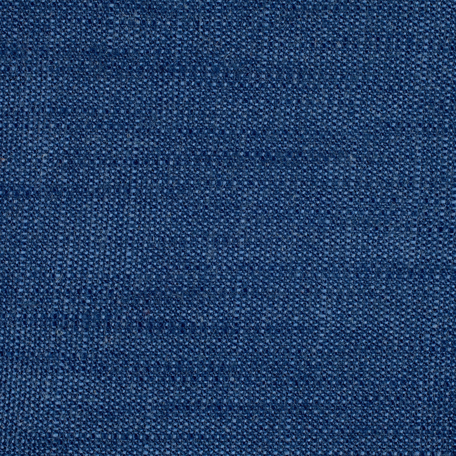 Close-up of dense navy woven fabric with fine pebbled tonal texture