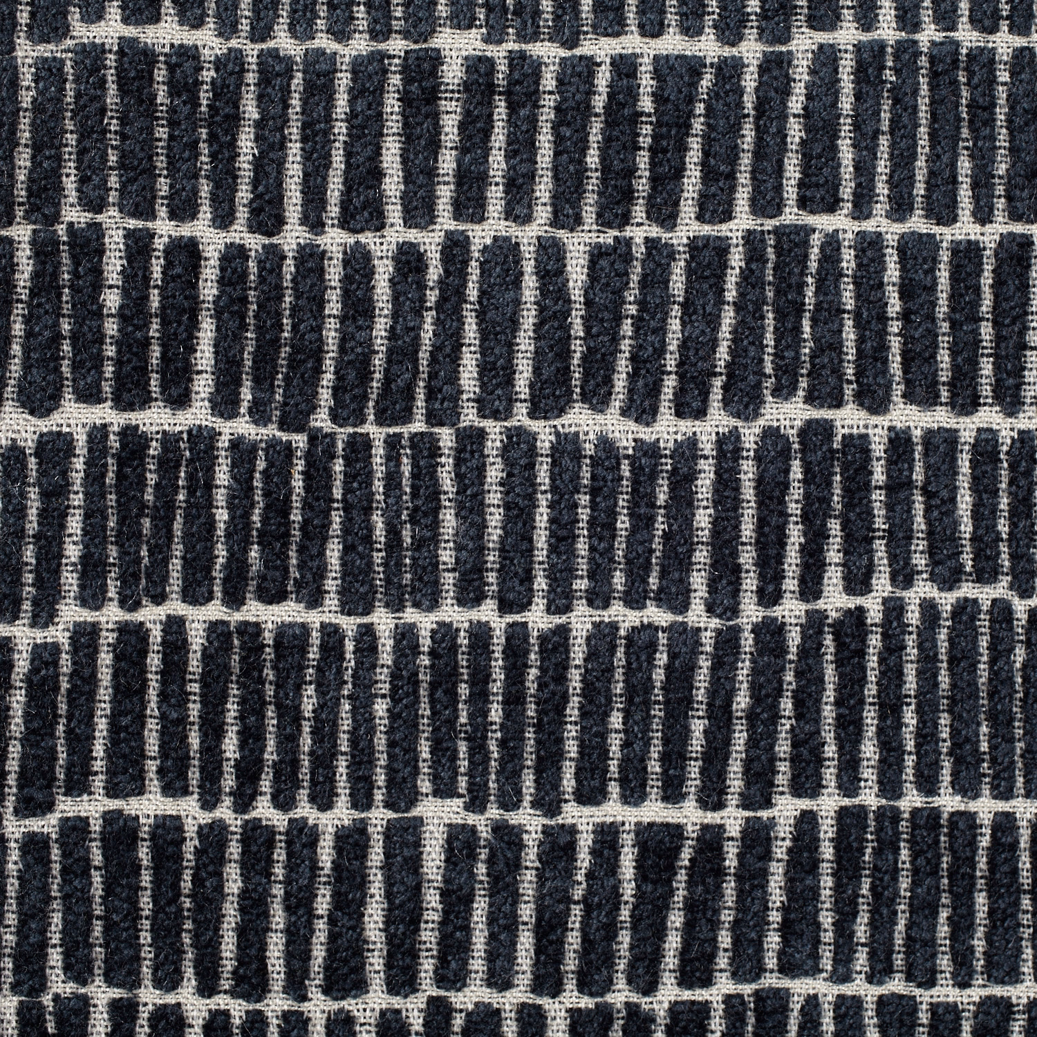 Midnight navy woven upholstery with irregular ivory vertical bars in horizontal rows