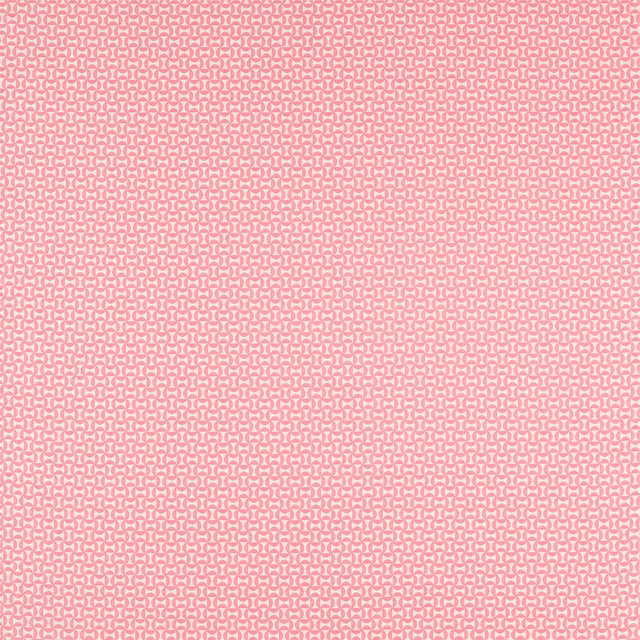 Soft flamingo pink fabric with a dense pale geometric woven repeat