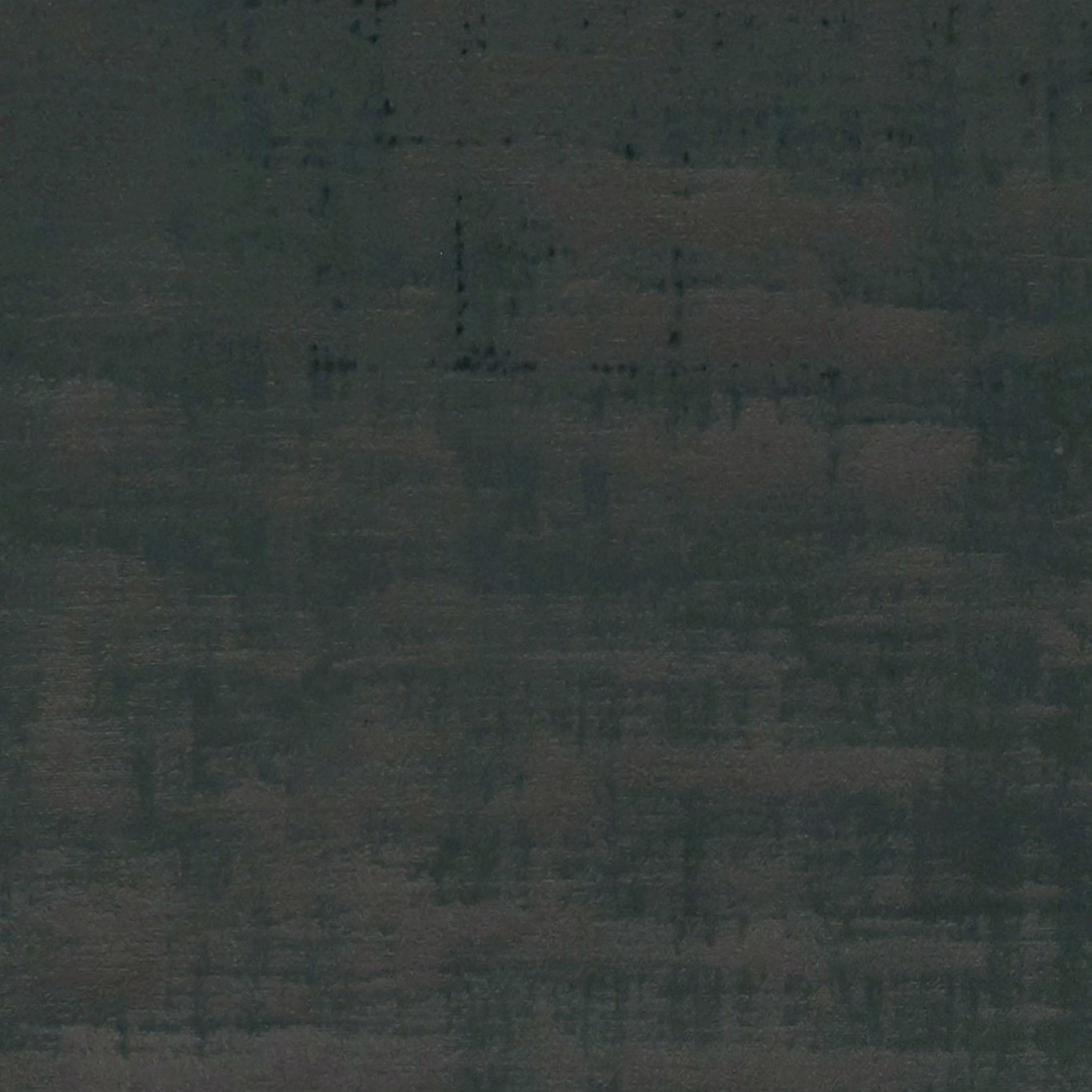 Close-up of dark emerald woven fabric with subtle charcoal grid-like tonal blocks
