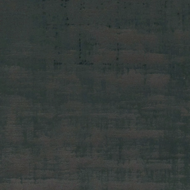 Close-up of dark emerald woven fabric with subtle charcoal grid-like tonal blocks