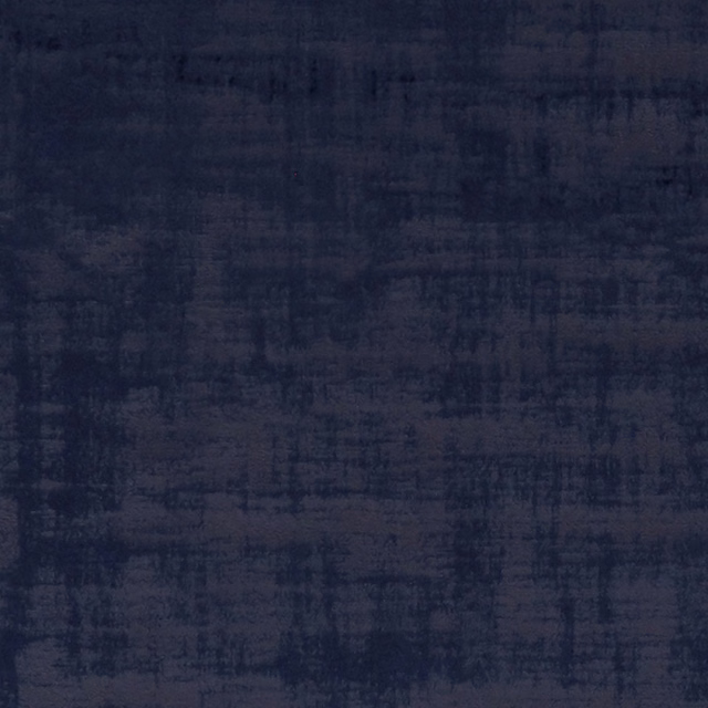 Deep indigo textile with smoky crosshatched brush marks and softly mottled texture