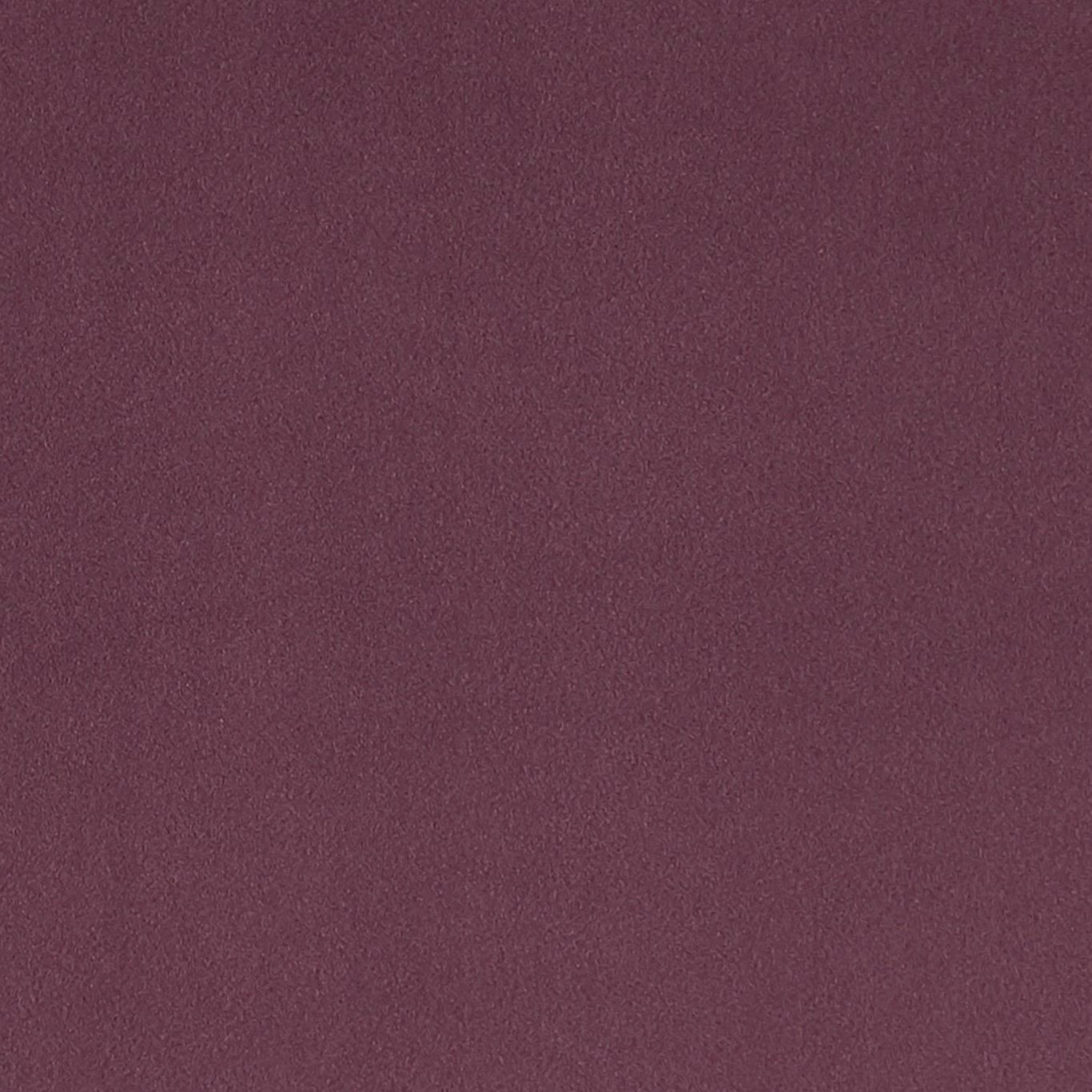 Close-up of muted heather-plum fabric with a softly mottled plain weave