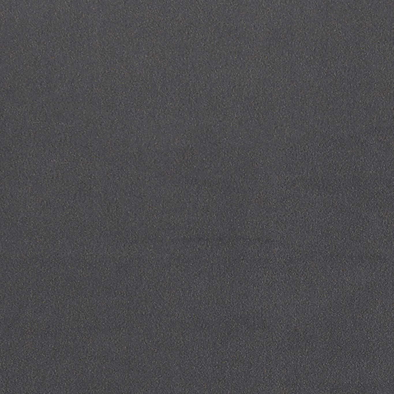 Close-up of deep charcoal-grey fabric with a subtle fine-grained mottled texture