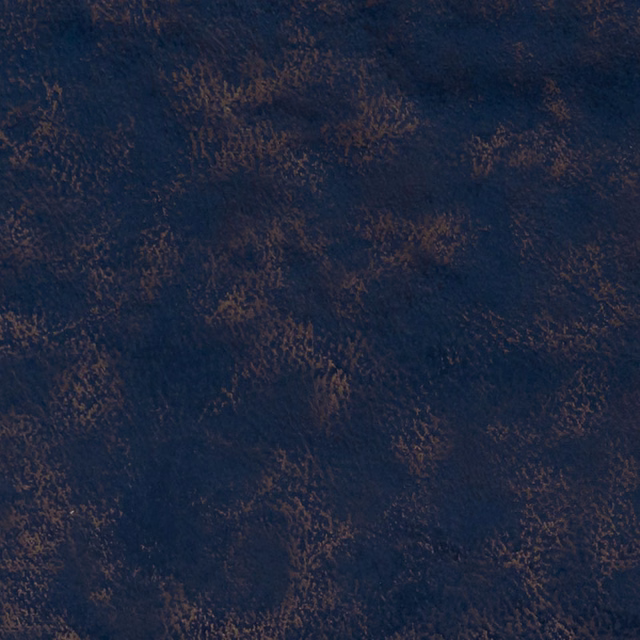 Deep indigo textured fabric with irregular russet-brown flecks and a softly mottled surface