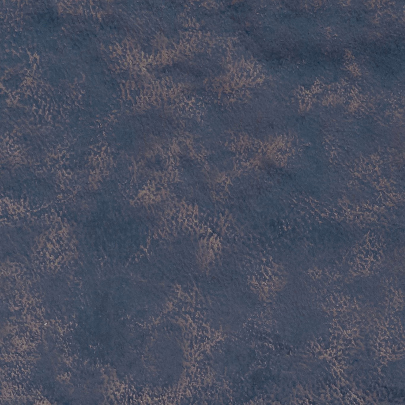 Navy blue textile with irregular bronze-brown mottled flecks and softly textured surface