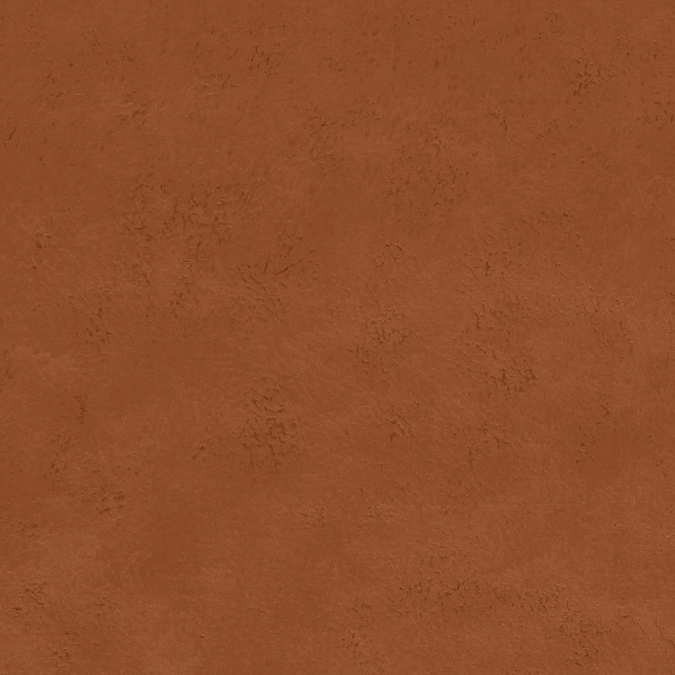 Close-up of warm spice terracotta fabric with a softly mottled surface