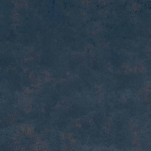 Close-up of deep teal mottled textile with dusky grey-brown textural flecks