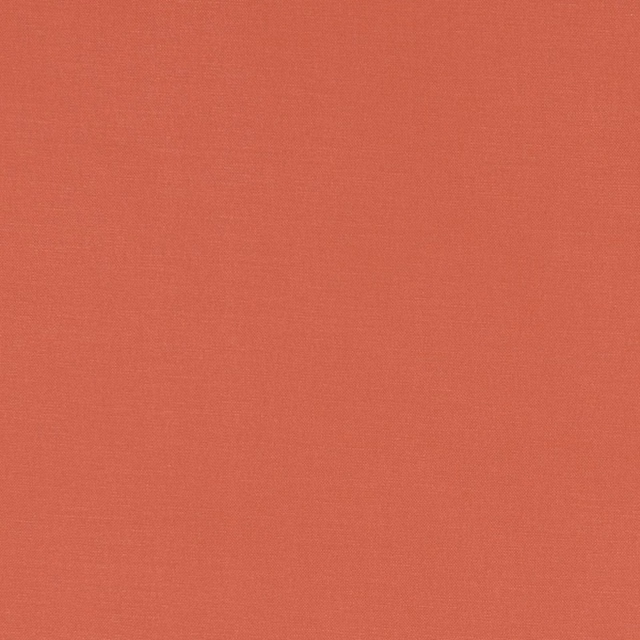 Warm coral terracotta fabric with a subtle fine plain weave texture