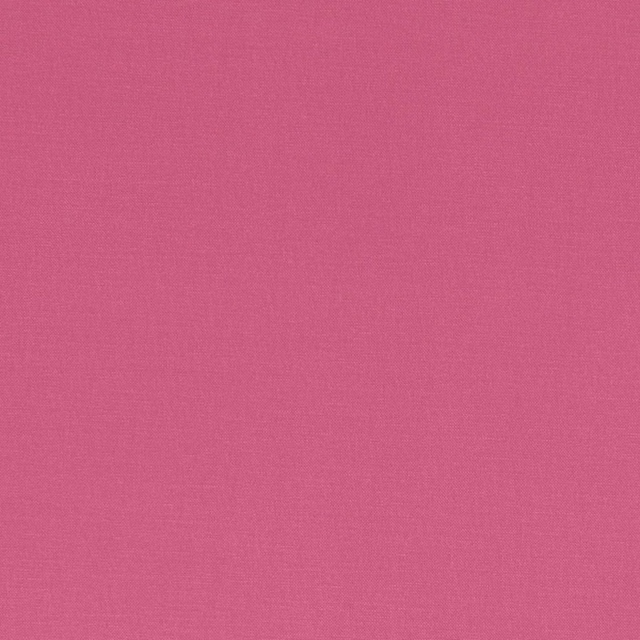 Close-up of saturated fuchsia fabric showing a fine, even woven texture