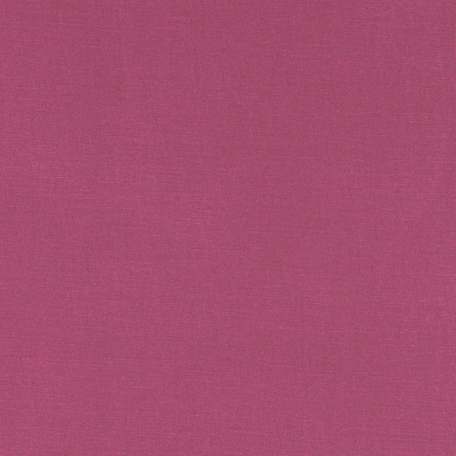 Close-up of Alora Magenta's finely woven, saturated pink-mauve textile surface