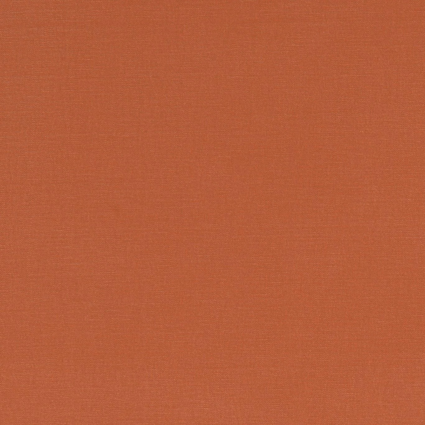 Close-up of muted paprika terracotta fabric with a fine, even woven texture