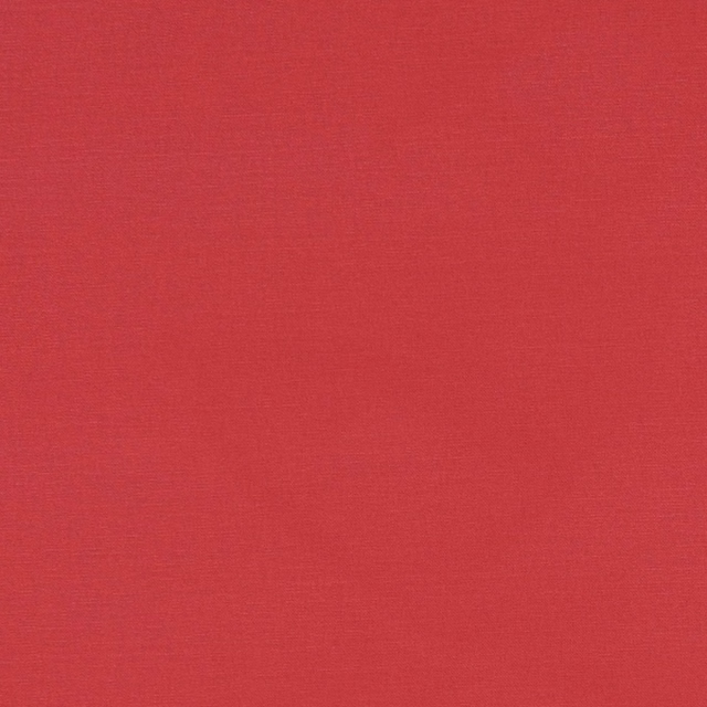 Close-up of Alora Rouge’s deep red plain weave with subtle horizontal texture