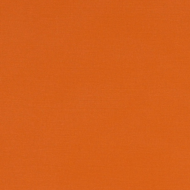 Close-up of Alora Spice, a finely woven warm burnt-orange textile.