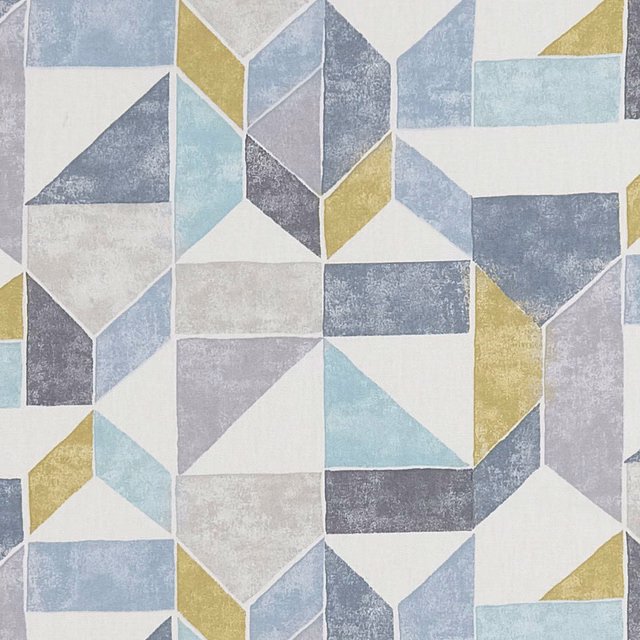 Charcoal, pale blue and ochre geometric textile with a softly weathered surface