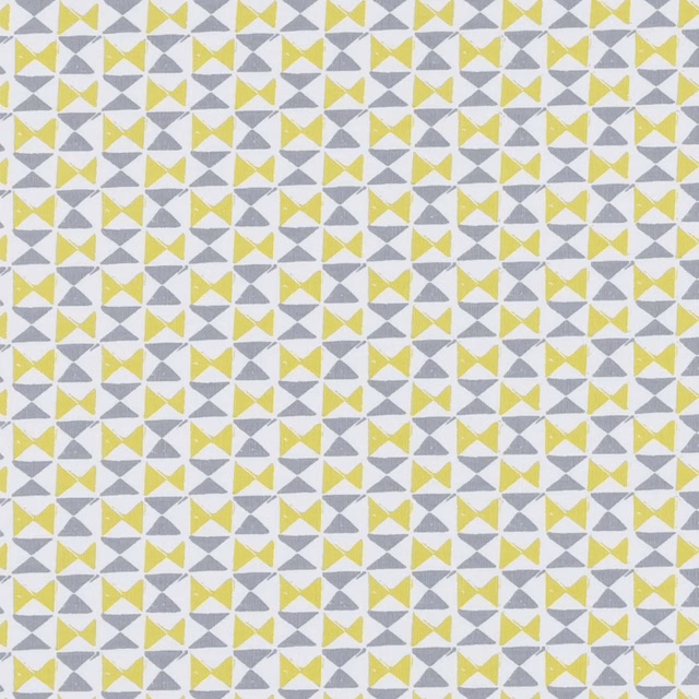 Small chartreuse bow-tie and charcoal triangle geometric repeat on pale woven fabric