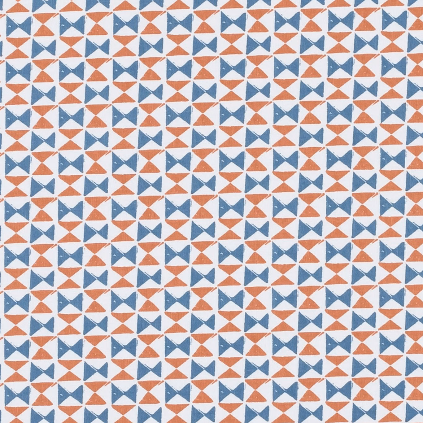 Small denim blue and spice geometric bow-tie motifs on a pale woven ground