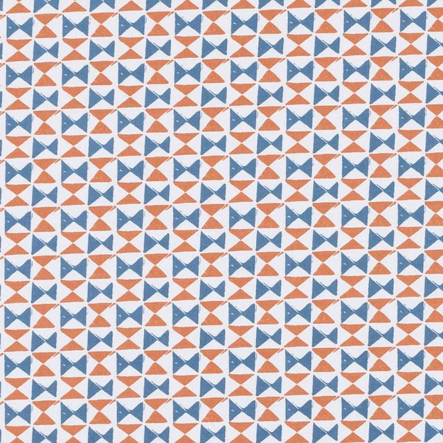 Small denim blue and spice geometric bow-tie motifs on a pale woven ground